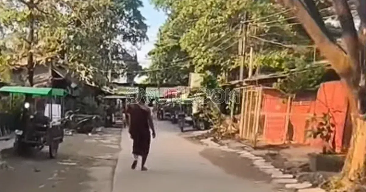 What is happening in the middle of the street in robes